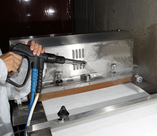 Engineering Conveyor Belt being cleaned by Duplex Cleaning Machines