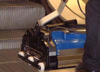 Duplex escalator cleaner showcasing its patented guide rail.