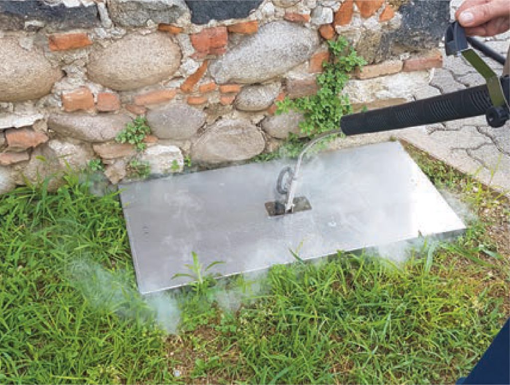 Image depicting steam weed control technology being used on roadsides and pathways, illustrating a safe, eco-friendly weed management solution.