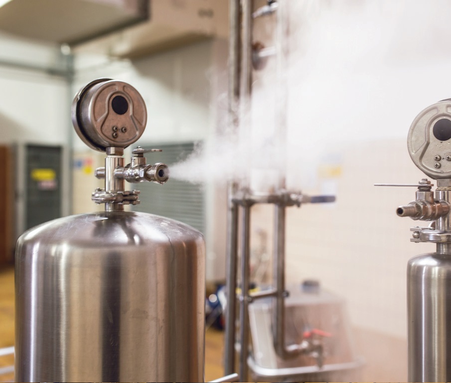 Showcasing the operational efficiency and versatility of cleaning equipment in a bottling line environment.