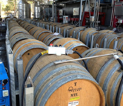 Image depicting the process of sanitising winery equipment using sophisticated cleaning technologies, ensuring optimal hygiene and quality.