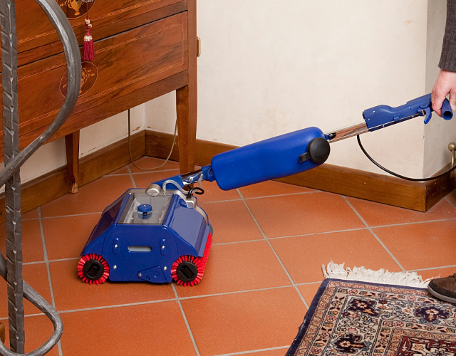 Cleaning hard vinyl and tiled floors in an aged care facility using a Thermoglide steam cleaner.