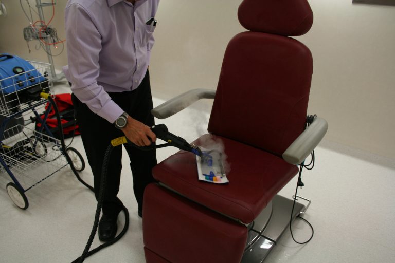 Image depicting the thorough cleaning and sanitisation process of dental chairs in a clinic, ensuring patient safety and comfort.