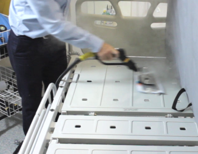Image showing the detailed process of cleaning and sanitising bed frames in a healthcare facility, ensuring high hygiene standards.