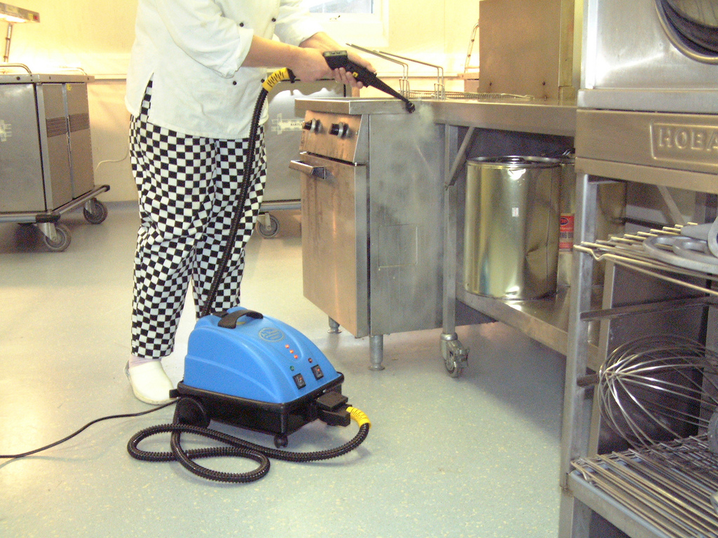 Image showcasing the thorough and efficient cleaning of a youth hostel kitchen, ensuring a hygienic and welcoming cooking space.