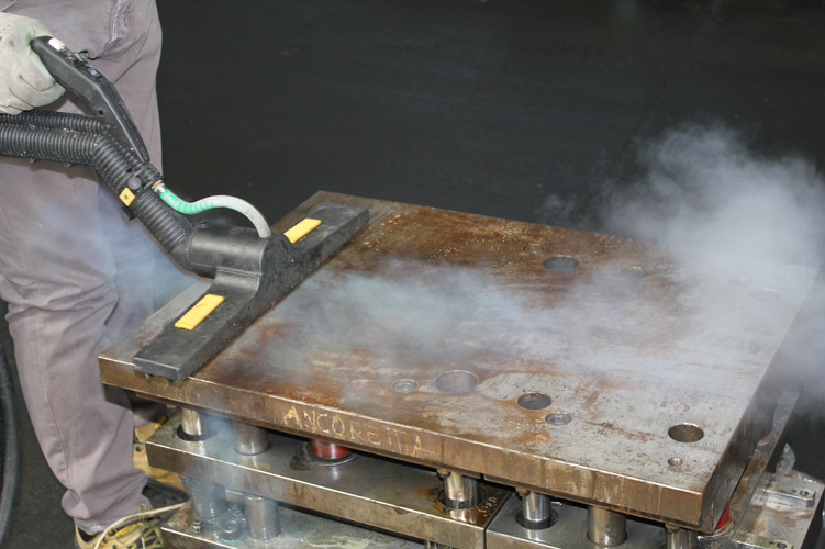 Image illustrating the powerful action of Steam Pressure machines blasting away grime and stains at a mining site, ensuring thorough cleanliness.