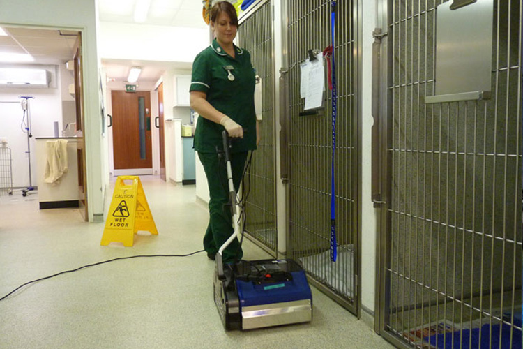 Image showcasing the use of Duplex floor scrubbers for quick and efficient cleaning of corridors and large areas in animal facilities.
