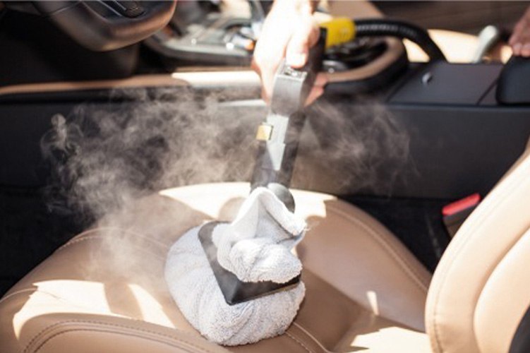 Image showcasing the use of steam cleaning technology for deep cleaning and revitalising leather seats in vehicles.