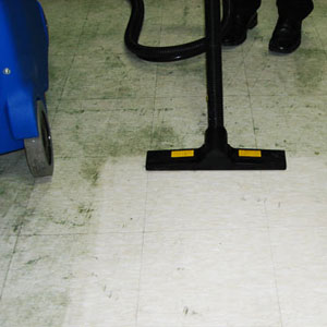 Image showing the use of Duplex steam cleaning machines for efficiently removing grease from kitchen floors.