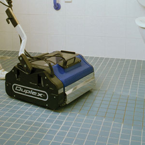 Image demonstrating the use of Duplex steam cleaning machines for efficient and thorough cleaning of floor tiles.