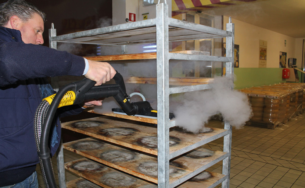 Image illustrating the detailed cleaning process of farming storage, shelves, cages, and tanks in a farm and dairy environment, showcasing thorough sanitisation.