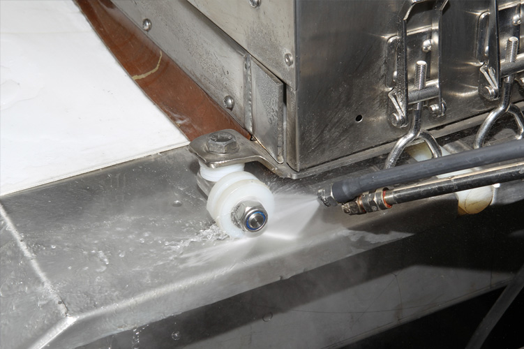 Image showing advanced steam cleaning technology being used on stainless steel equipment in a farm and dairy setting, highlighting eco-friendly and efficient cleaning methods.