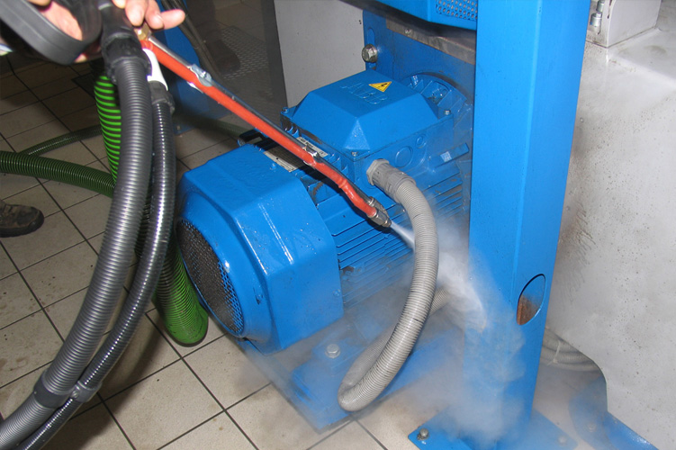 Image showing the effective use of Steam Pressure technology in blasting and disintegrating large chunks of dry ice in an ice cream production facility.