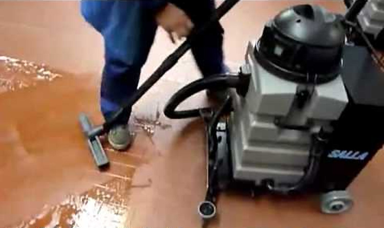 Image showing the Batvac 50 machine in action, effectively cleaning large hard and cement floor areas at a mining site, demonstrating its wet and dry capabilities.