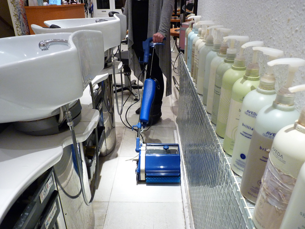 Image depicting Duplex Cleaning Machines' effective cleaning of hard floors, tiles, and grout lines in salons, ensuring deep cleanliness and hygiene.