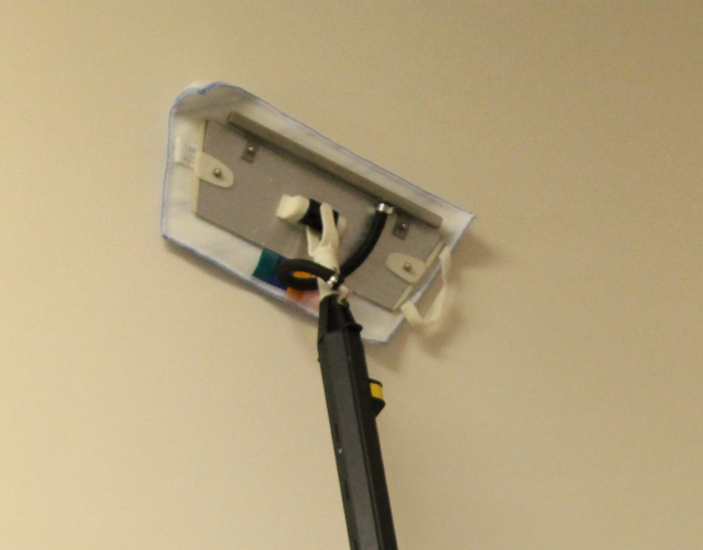 Image depicting the effective cleaning of walls and ceilings in a veterinary clinic using Duplex Cleaning Machines' specialised equipment.