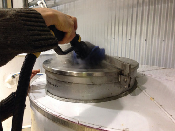 Image showing the use of advanced cleaning technology for quick and thorough sterilisation of winery equipment, ensuring eco-friendly and efficient maintenance.