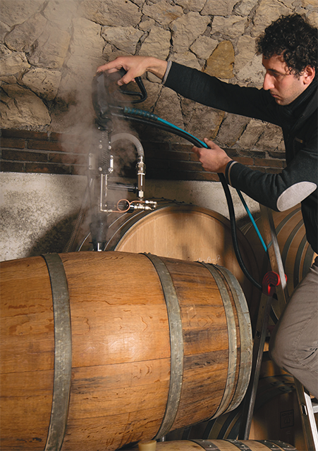 Image showing the use of +100°C steam for rapid and thorough disinfection of wine barrels in a winery, enhancing the quality and longevity of the barrels.