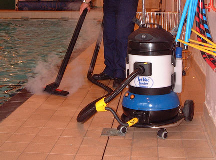 Jetvac Junior Steam Vacuum Cleaning Machine in use, demonstrating its environmentally friendly cleaning capabilities.