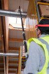 Image of the Tess High Ceiling Vacuum Cleaner equipped with a lightweight pole for easy access to high areas.
