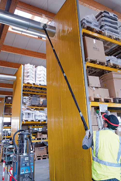 Image showing the Tess High Ceiling Vacuum Cleaner performing indoor high-level cleaning.