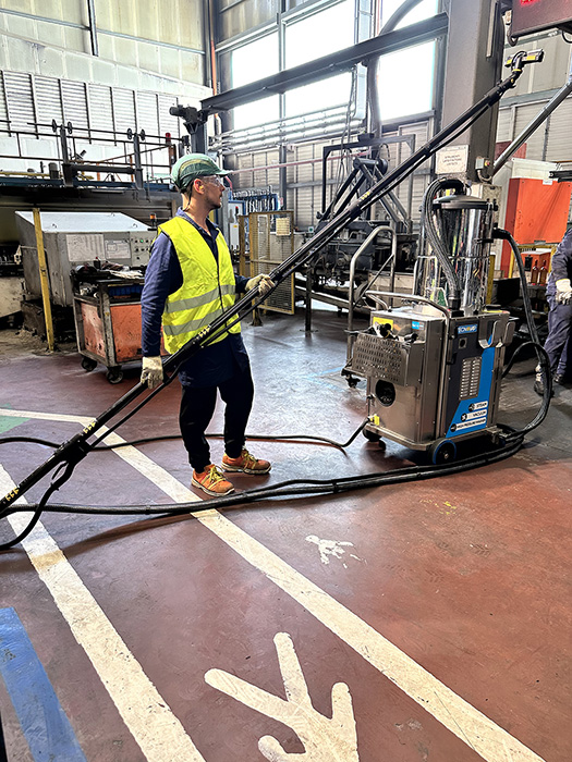 Image showing a single operator using the Tess High Ceiling Vacuum Cleaner to ensure Occupational Health and Safety (OHS) compliance.