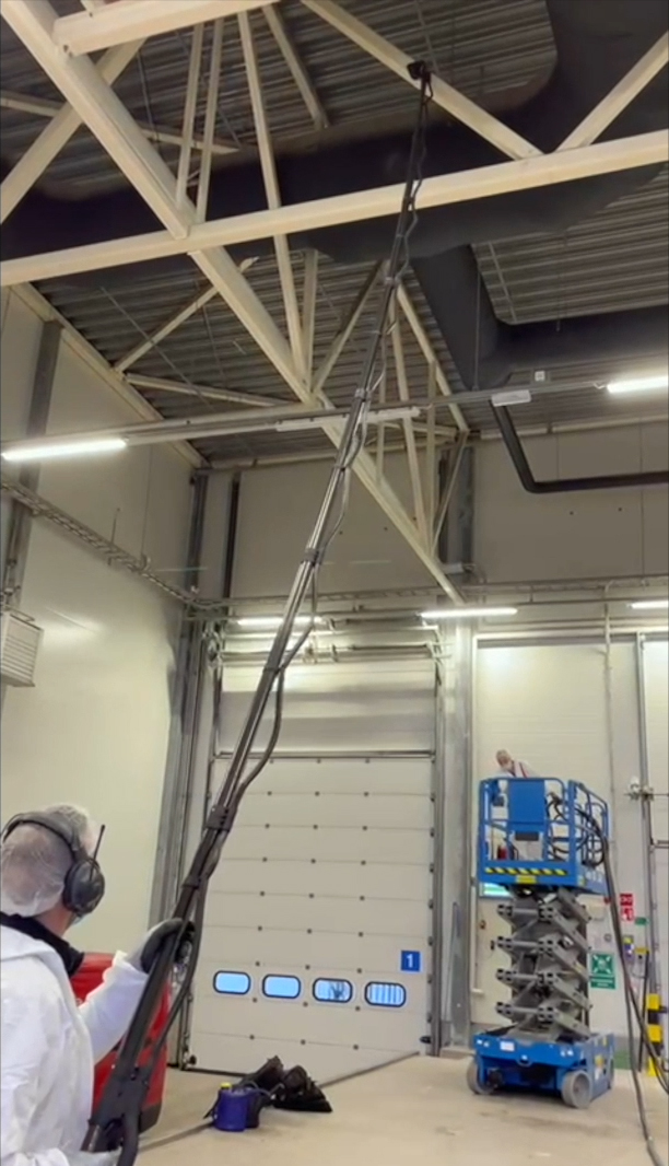 Image of the Tess High Ceiling Vacuum Cleaner demonstrating its versatile cleaning capabilities in various settings.