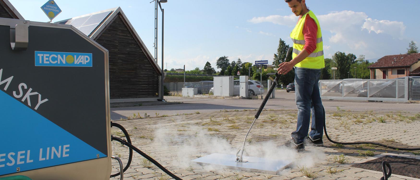Commercial weed steamer in use, showcasing effective and eco-friendly weed control on a paved surface. This steam weed control system is ideal for food factories and other commercial applications, ensuring thorough weed removal without chemicals.
