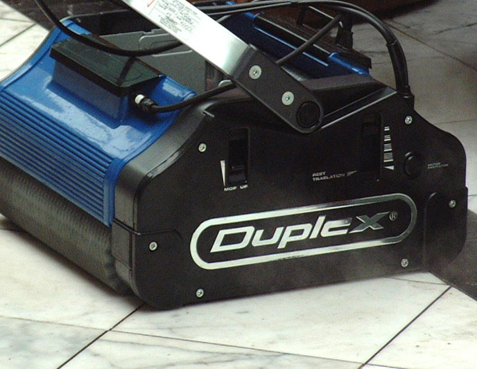 Duplex 420 commercial floor steam floor scrubber's washing, scrubbing, and drying in a single pass. The counter-rotating brushes operate at 600rpm, lifting dirt, water, and grime from the floor, ensuring quick drying and efficient cleaning in commercial environments.