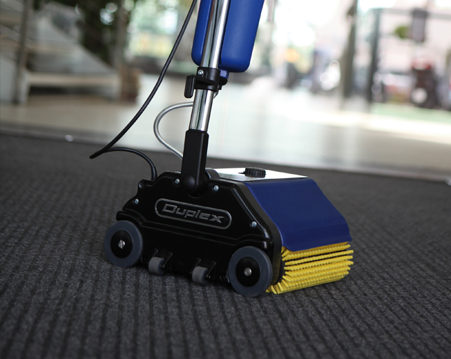 Duplex 280 small commercial floor scrubber cleaning a carpet