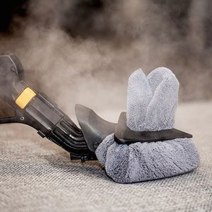 Duplex steam cleaning equipment targeting and eliminating bed bugs on a mattress, demonstrating effective and eco-friendly cleaning without the use of chemicals.