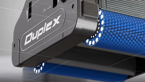 Close-up of Duplex 340 floor cleaner with counter-rotating brush system.