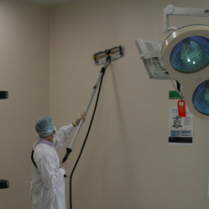 Duplex steam mop used to clean the wall in a hospital.