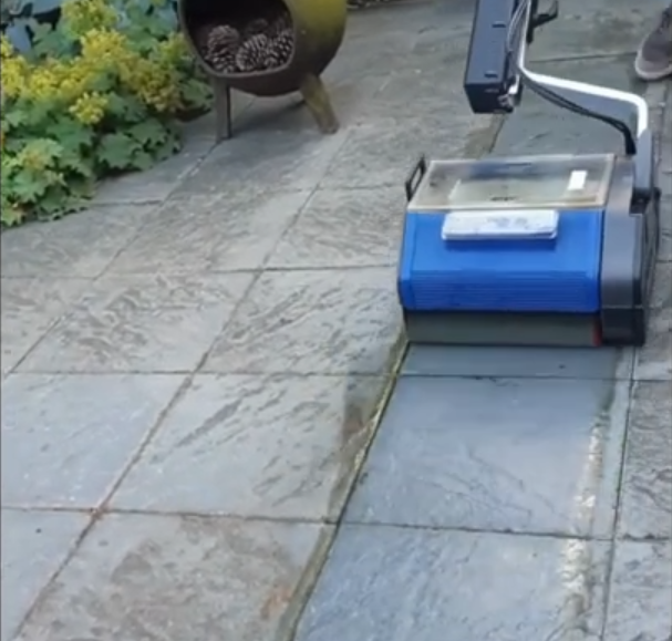 Duplex 420 machine scrubbing an outdoor marble floor with visible contrast between cleaned and dirty sections